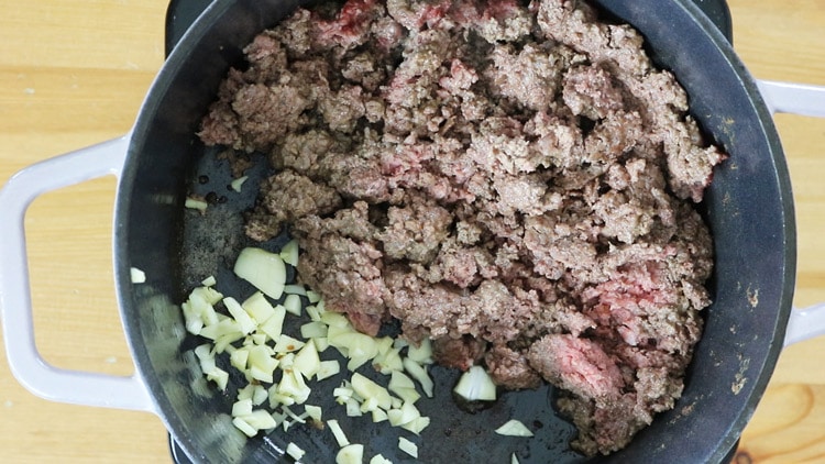 Then, add onions and spices.