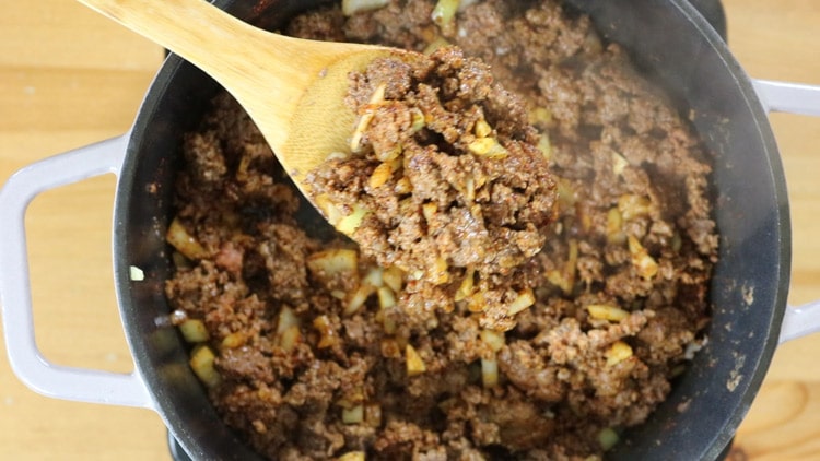 Make sure to stir and combine all those ingredients into the ground beef. Stir until the meat is completely brown.